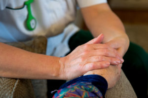 nurse holding a hand