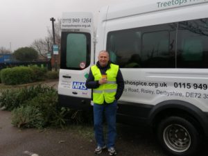 Man smiling by Treetops minibus