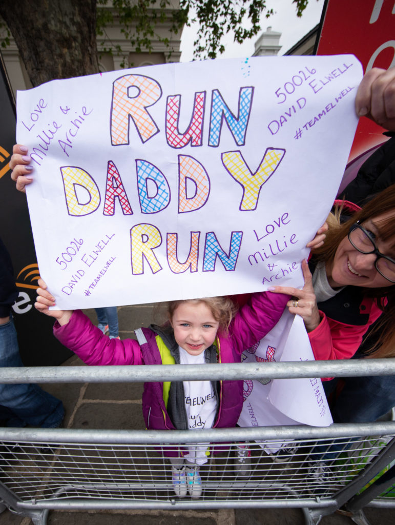 Young girl supporting her dad in the London Marathon