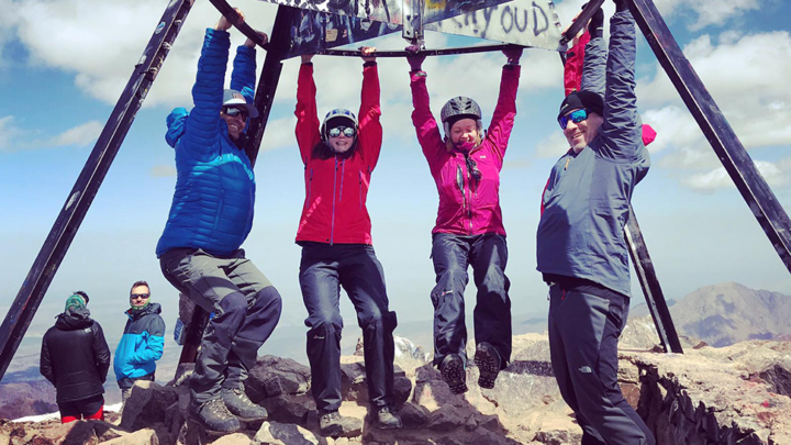 Team celebrating reaching the top of Mt Toubkal