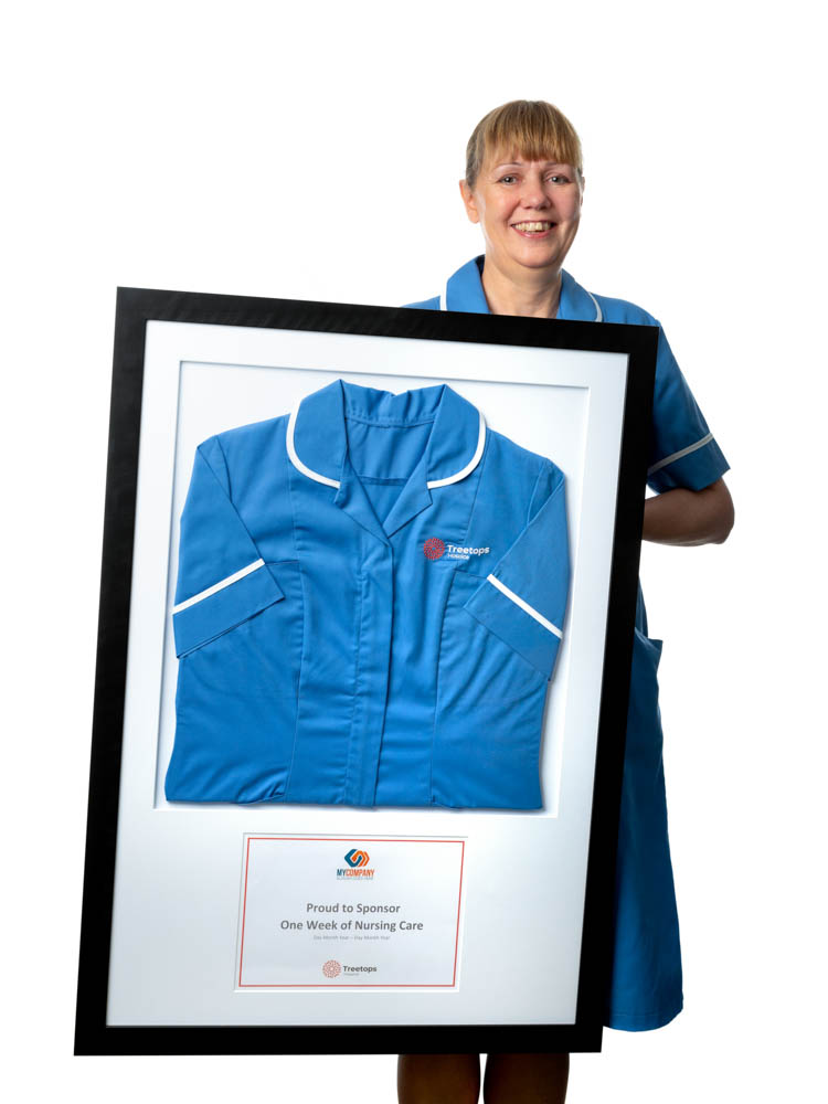 Nurse smiling holding frame