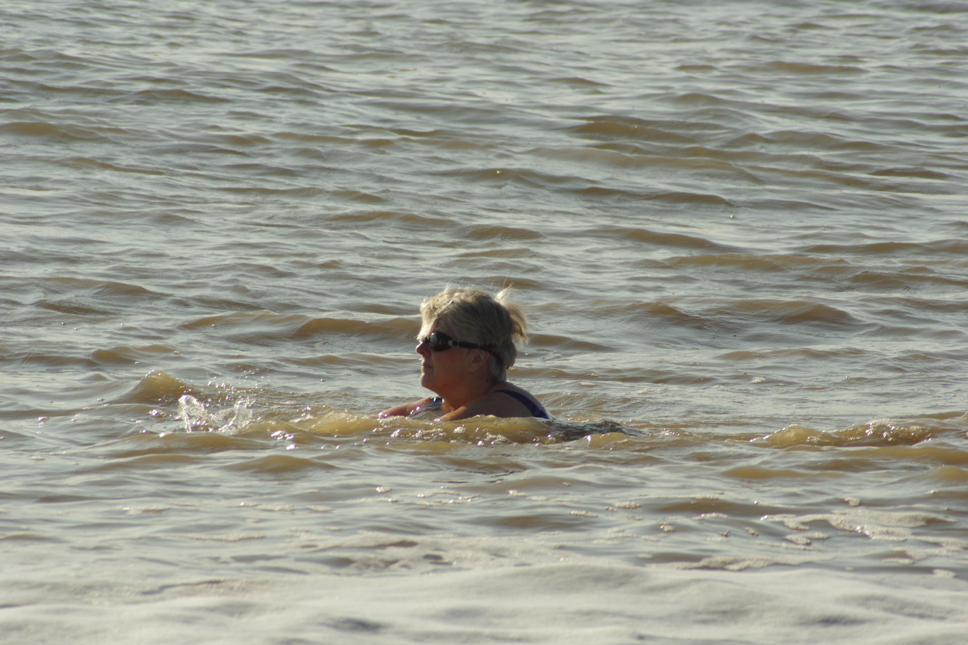 Woman swimming in open water