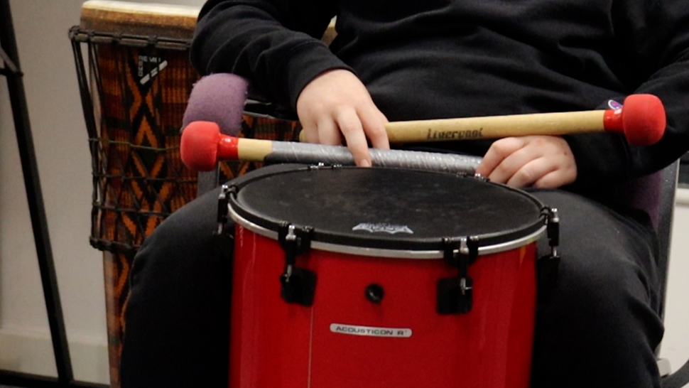 Young boy drumming