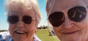 Mother and daughter smiling in selfie photo