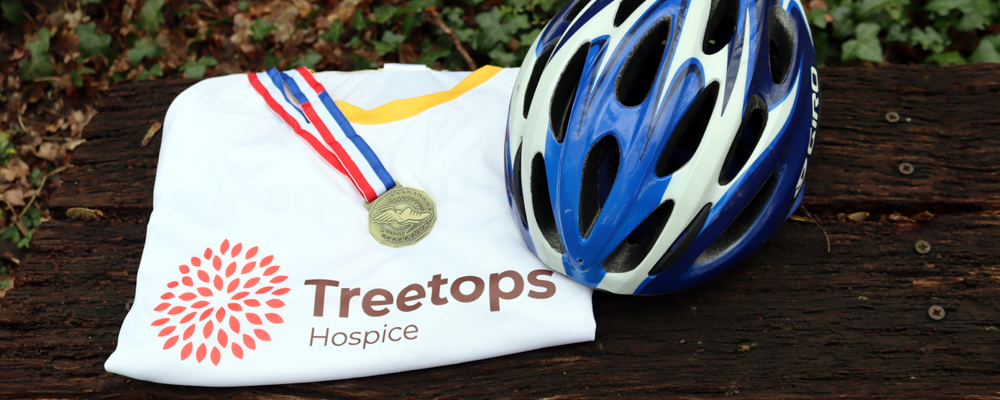 Treetops T-shirt and bike helment on bench