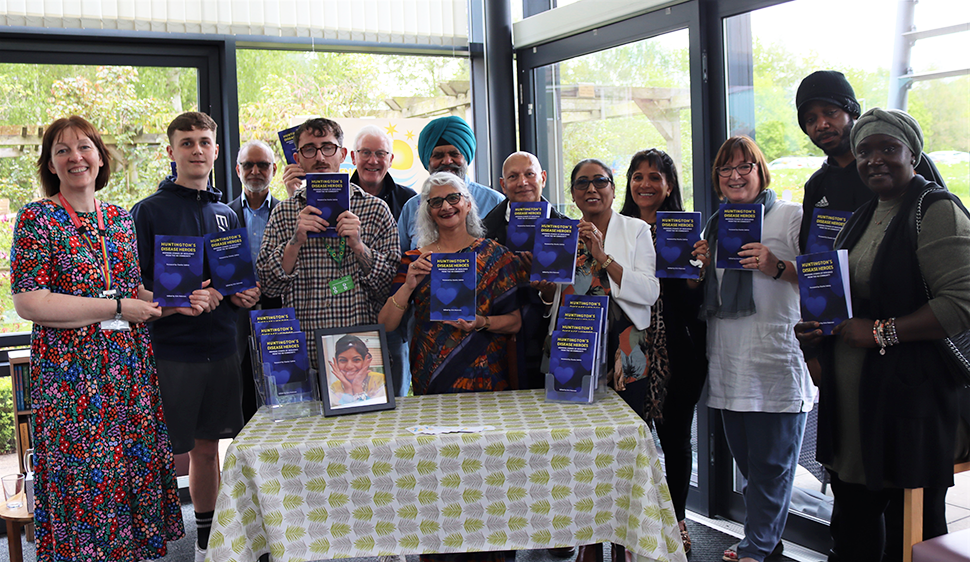 Group of smiling people at book launch at Treetops Hospice