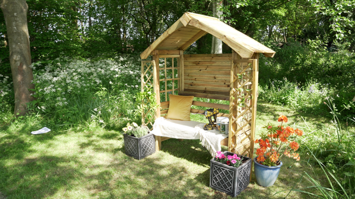 Wooden arbour located in grounds of Treetops Hospice