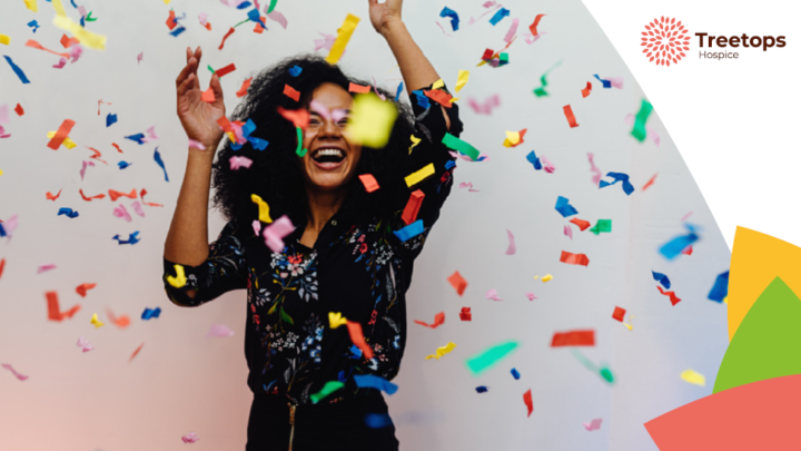 woman celebrating surrounded by confetti