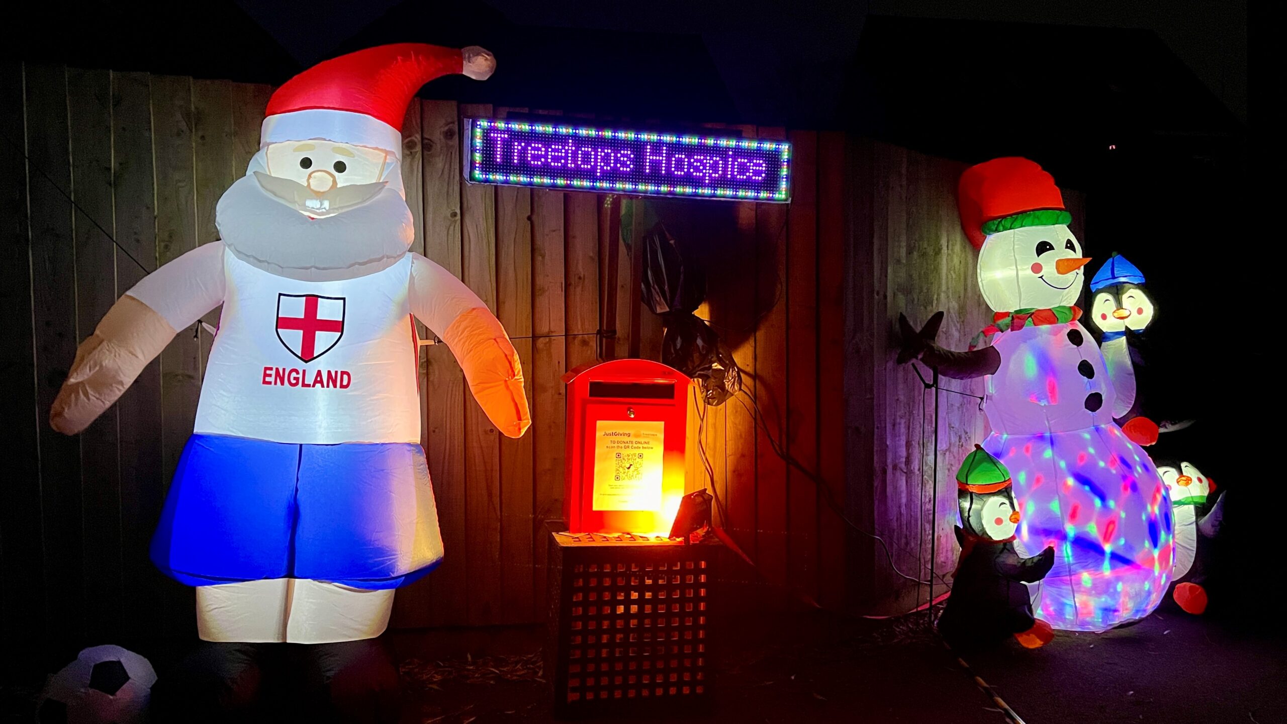 Inflatable Christmas characters outside a house