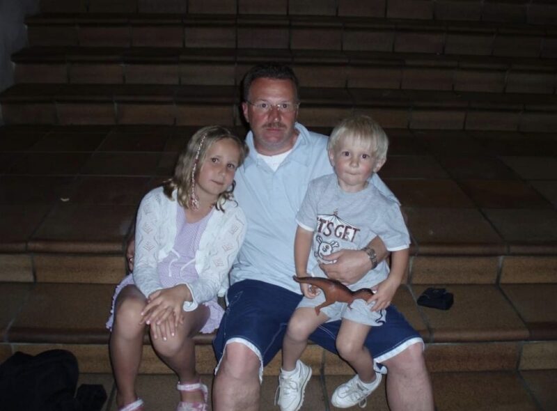 A man and two children.